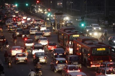 Traffic moves along a busy road in New Delhi