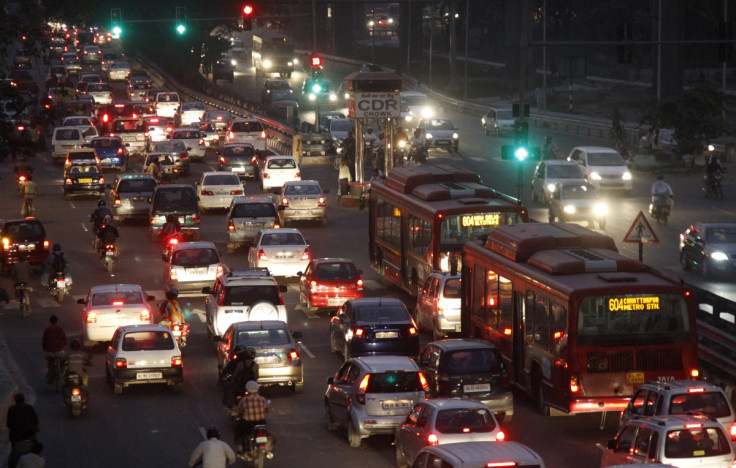 Traffic moves along a busy road in New Delhi