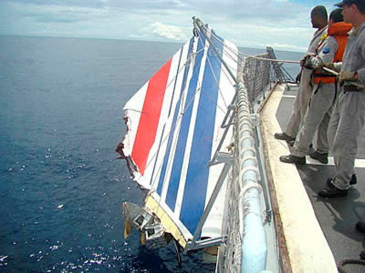 Brazilian Navy picks a piece of debris from Air France flight AF447 out of the Atlantic Ocean, some 745 miles (1,200 km) northeast of Recife