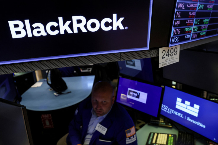 Traders work on the floor of the NYSE in New York