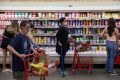 People shop in a supermarket as inflation affected consumer prices in Manhattan, New York City