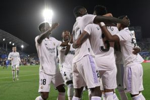 Real Madrid players celebrate their opening goal scored by Brazilian defender Eder Militao against Getafe