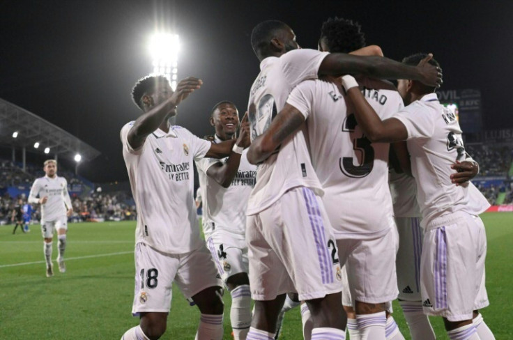 Real Madrid players celebrate their opening goal scored by Brazilian defender Eder Militao against Getafe