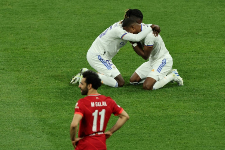 Can we play you every week?: Real's Eduardo Camavinga and David Alaba celebrate as Mohamed Salah looks away after the Spanish club beat Liverpool in the Champions League final in May