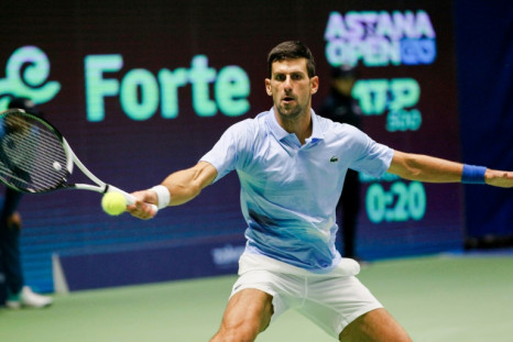 'Super-pumped': Novak Djokovic returns the ball to Stefanos Tsitsipas during Sunday's final in Astana