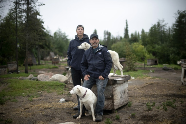 Canadian musher David Daley, pictured with his son Wyatt Daley in Churchill, northern Canada, lives where the tundra ends and the boreal forest begins