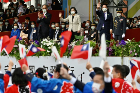 Taiwan's President Tsai Ing-wen (top C) attends a ceremony to mark the island's National Day in front of the Presidential Office in Taipei on October 10, 2022.