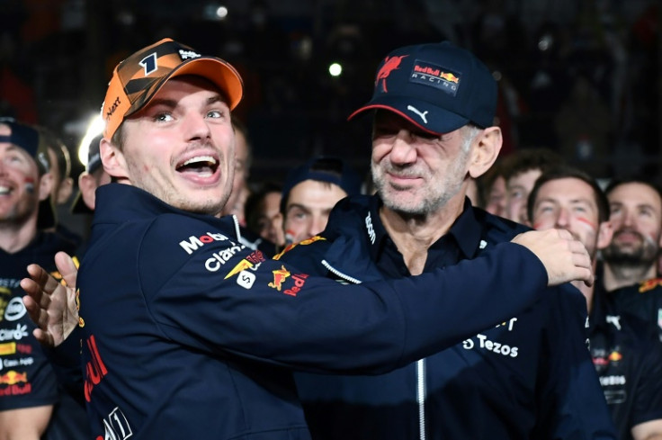 Max Verstappen (left) celebrates his second world championship with Red Bull engineers and pit crew at Suzuka