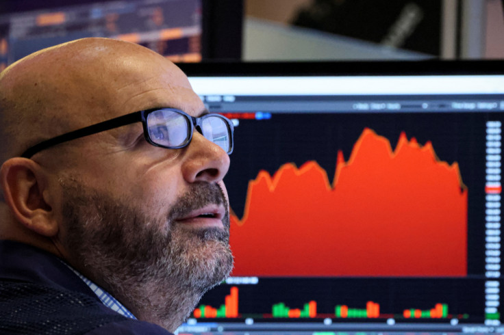 Traders work on the floor of the NYSE in New York