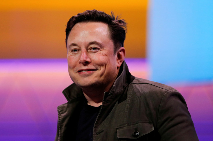 SpaceX owner and Tesla CEO Elon Musk smiles during a conversation with legendary game designer Todd Howard at the E3 gaming convention in Los Angeles