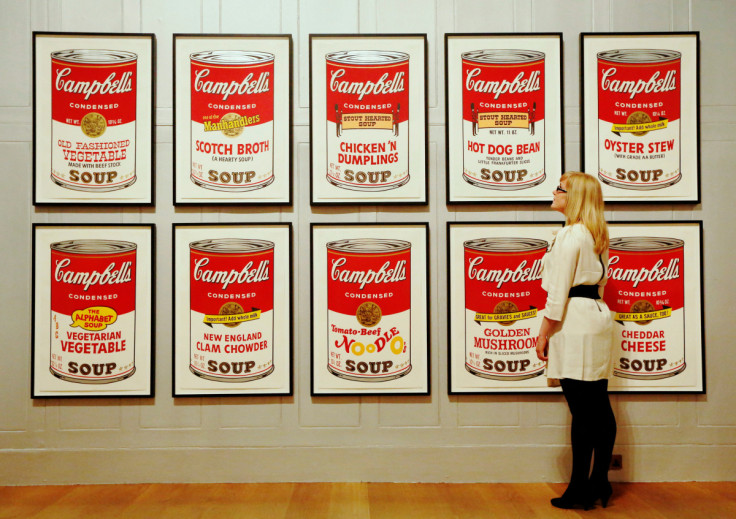 Gallery employee Maddy Adeane poses with Andy Warhol's "Campbell's Soup II" (1969) at the Dulwich Picture Gallery in London