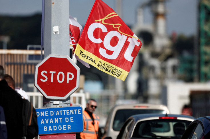 Workers on strike gather in front of the TotalEnergies oil refinery in Gonfreville-l'Orcher