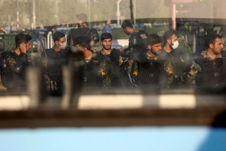Iran's riot police forces stand in a street in Tehran, Iran