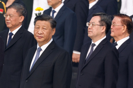 Chinese President Xi Jinping and Director of the General Office of the Central Committee Ding Xuexiang attend a wreath laying ceremony on Tiananmen Square to mark Martyrs' Day in Beijing
