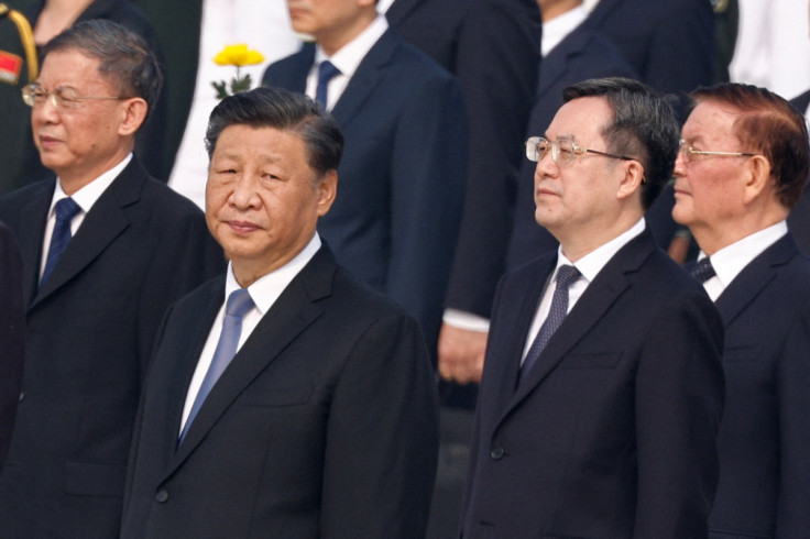 Chinese President Xi Jinping and Director of the General Office of the Central Committee Ding Xuexiang attend a wreath laying ceremony on Tiananmen Square to mark Martyrs' Day in Beijing