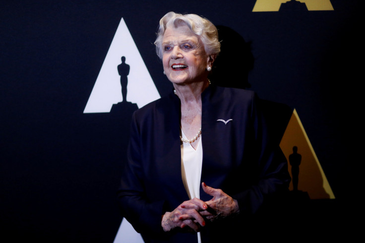 Actress Lansbury, who voiced the character of Mrs. Potts, poses as she arrives for the 25th anniversary celebration of "Beauty and the Beast" at the Academy of Motion Picture Arts and Sciences in Beverly Hills