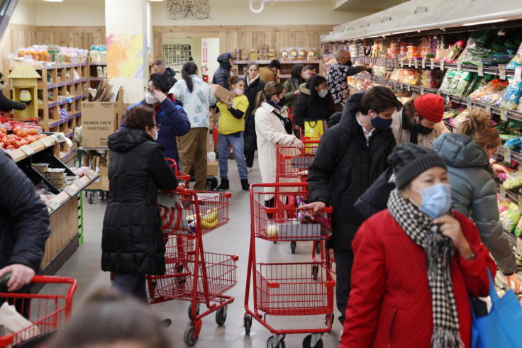 People shop in a grocery store in Manhattan, New York City