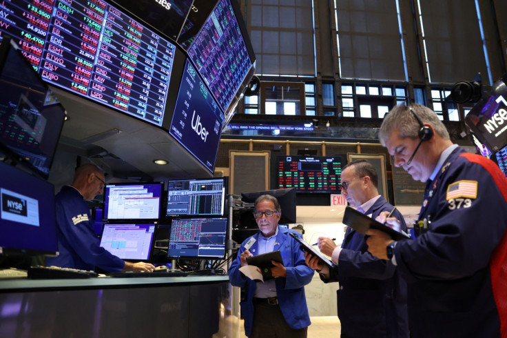 Traders work on the trading floor at the New York Stock Exchange (NYSE) in Manhattan, New York City