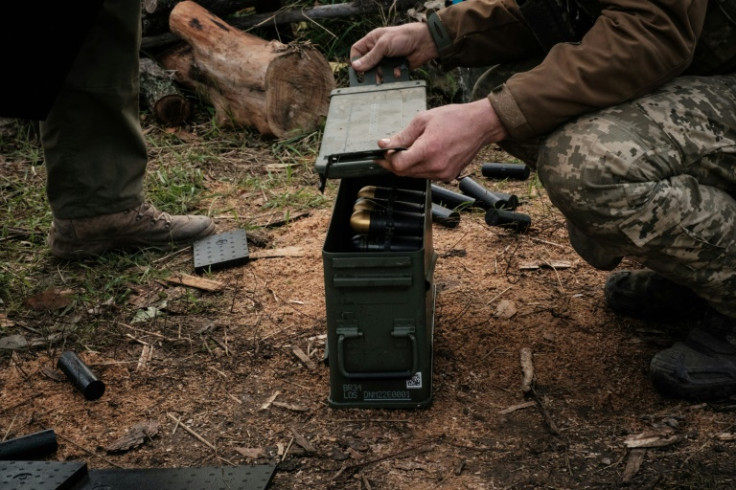 Soldiers of Ukraine's 5th Regiment of Assault Infantry put ammunition into a crate before setting a US-made MK-19 automatic grenade launcher towards Russian positions in less than 800 metres away at a front line near Toretsk in the Donetsk region