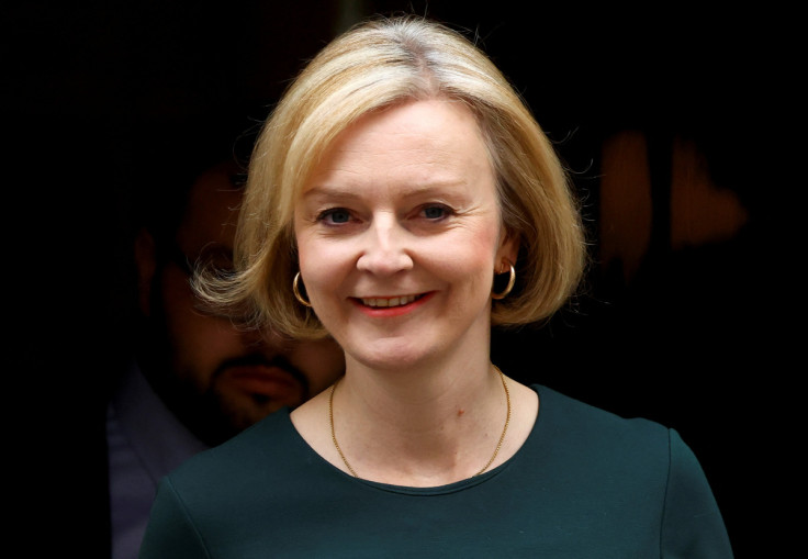 British Prime Minister Liz Truss walks outside Number 10 Downing Street, in London