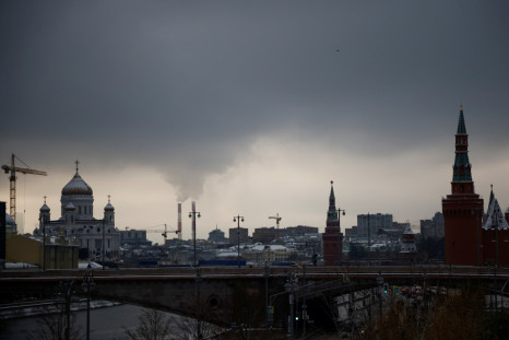 Steam rises from chimneys of a heating power plan over the skyline of central Moscow