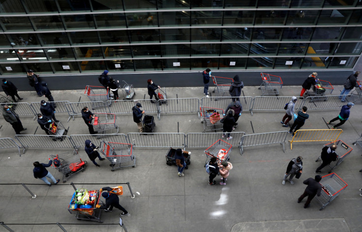 Shoppers practice social distancing as they wait to enter Target store during the outbreak of coronavirus disease (COVID-19) in New York