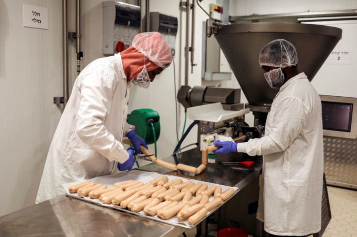 Workers pack links of 3D printed plant-based vegan sausages, produced by Israeli start-up Redefine Meat, in Rehovot