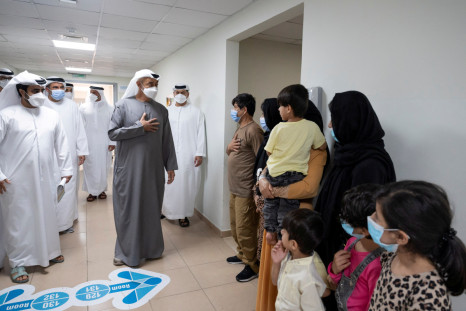 Abu Dhabi's Crown Prince Sheikh Mohammed bin Zayed al-Nahyan visits evacuee families from Afghanistan at Emirates Humanitarian City in Abu Dhabi