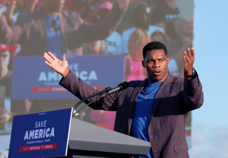 Former college football star and current senatorial candidate Herschel Walker speaks at a rally in Perry