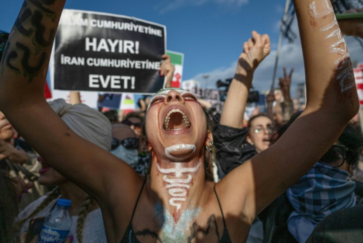 A woman shouts at a solidarity rally in Istanbul