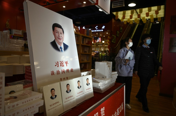 Chinese leader Xi Jinping, pictured on the cover of a book titled "The Governance of China", is expected to be reconfirmed as the Communist Party's general secretary, cementing his position as China's most powerful leader since Mao Zedong