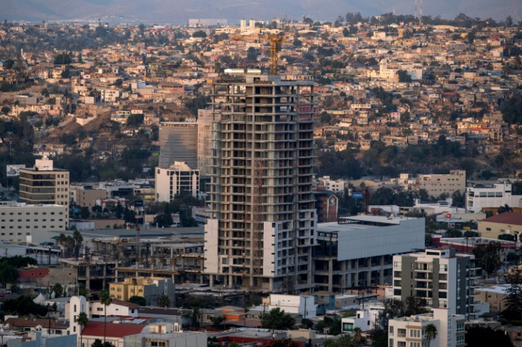 New apartment buildings are springing up in Tijuana with "For Sale" signs in English and prices in dollars