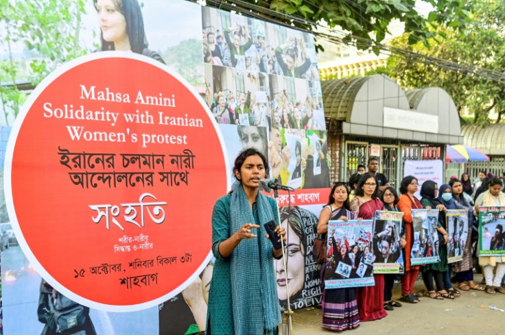 Activists display placards in support of Iranian women during a demonstration in Dhaka, Bangladesh