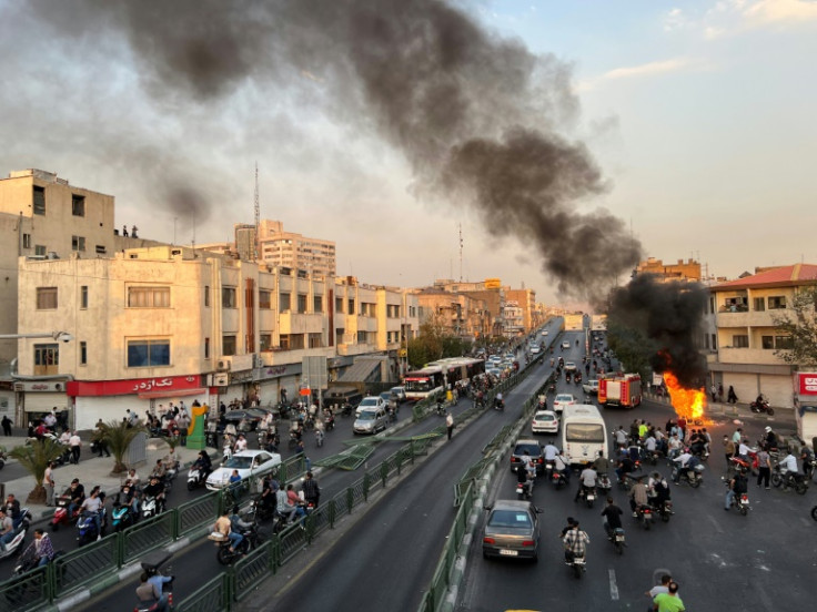 A picture obtained by AFP outside Iran reportedly shows a motorcycle on fire in the capital Tehran, on October 8, 2022