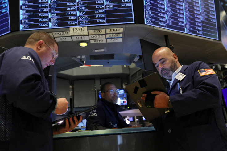 Traders work on the floor of the NYSE in New York