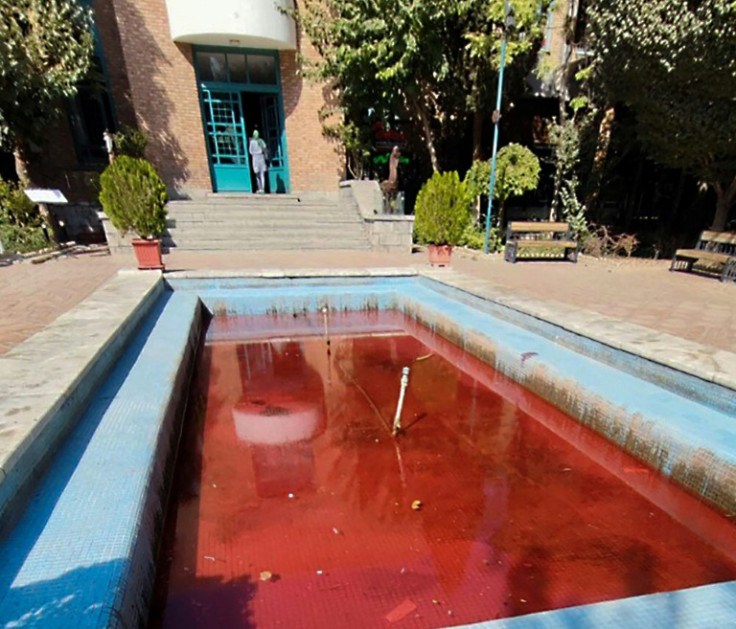 A picture obtained by AFP outside Iran on October 7, 2022 shows a fountain with its water coloured red outside the Artists Forum at Tehran's Honarmandan Park