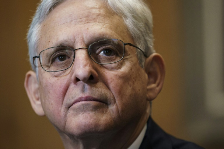 US Attorney General Merrick Garland accuses Beijing of trying to "interfere with" and "undermine" the American justice system by harassing dissidents and pressuring US academics to work for them