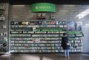 A person browses games at an XBox One Display in a GameStop in Manhattan, New York