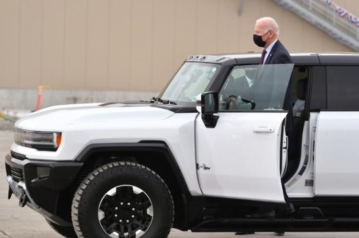 US President Joe Biden, shown here in November 2021 beside a GMC Hummer EV, has embraced the large electric trucks that dominate the Detroit automaker's response to climate change
