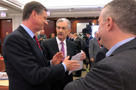 Federal Reserve Chairman Jerome Powell speaks with Chicago Fed President Charles Evans and St Louis Fed President James Bullard at a conference on monetary policy at the Federal Reserve Bank of Chicago