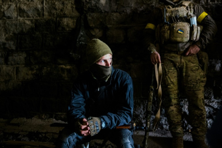 A Ukrainian soldier looks on in the town of Bakhmut, in eastern industrial Ukraine's Donbas region
