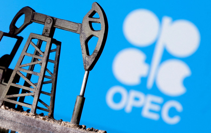 A 3D printed oil pump jack in front of the OPEC logo