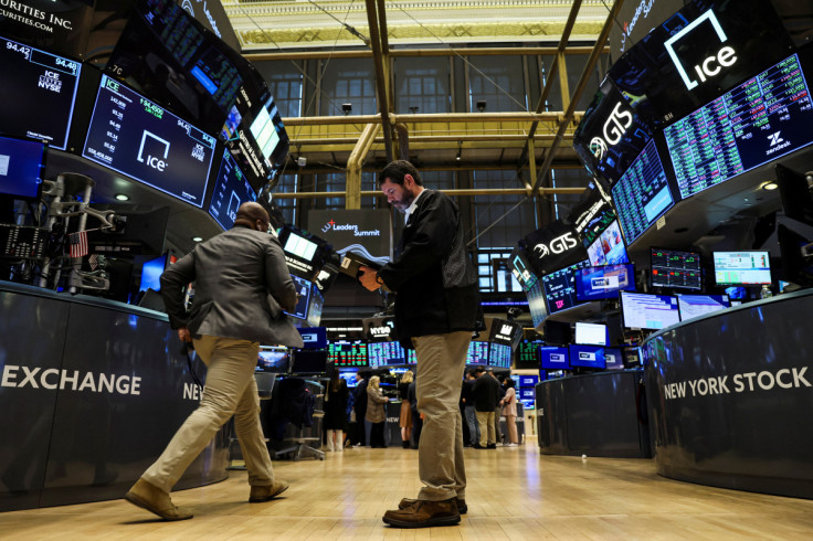 Traders work on the floor of the NYSE in New York