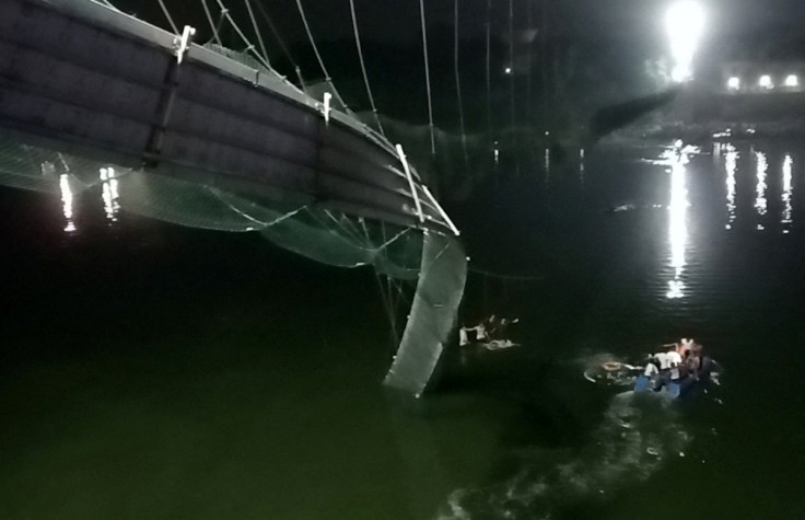 A view shows a damaged part of a suspension bridge after it collapsed in Morbi