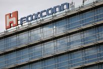 The logo of Foxconn, the trading name of Hon Hai Precision Industry, is seen on top of the company's building in Taipei