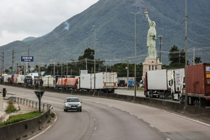 Supporters of President Jair Bolsonaro, mainly truck drivers, erect a replica Statue of Liberty as they block the BR-101 highway in Palhoca, in the metropolitan region of Florianopolis