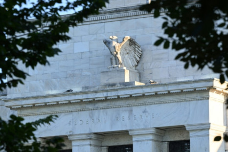 The US Federal Reserve said more rate hikes will be needed to tame inflation, but opened the door to a slower pace of increases