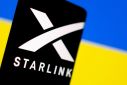 Illustration shows Starlink logo and Ukraine flag