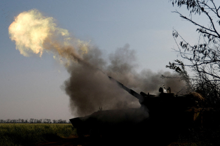 Ukrainian servicemen fire a self-propelled howitzer toward Russian positions on a frontline in Mykolaiv region