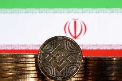 Illustration shows representations of cryptocurrency Binance and Iran flag